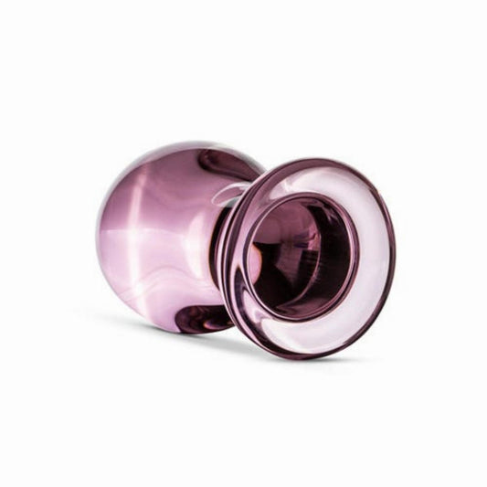 Roze glazen buttplug van Gildo, zijaanzicht met brede voet