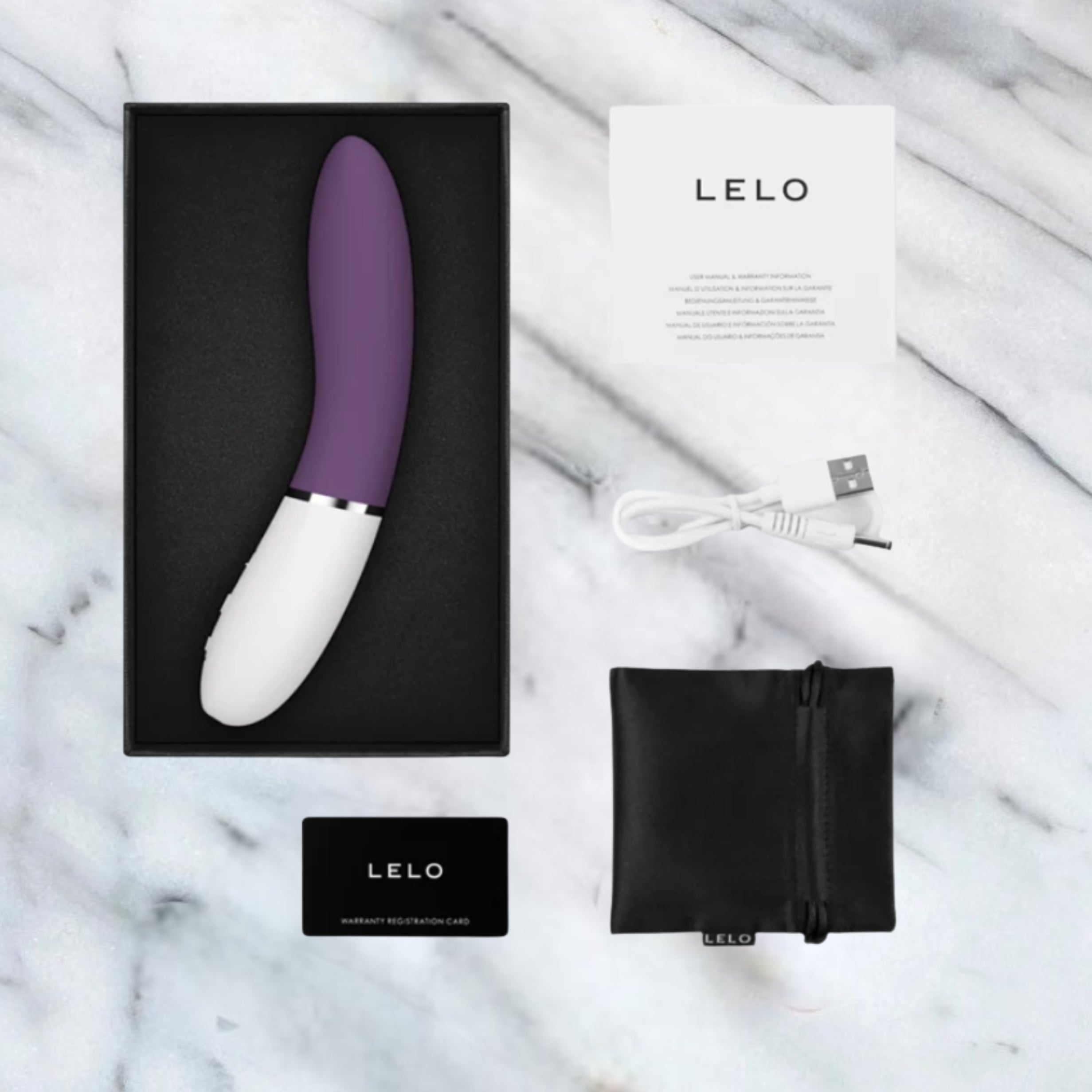 Inhoud van de doos van de Lelo Liv 3: vibrator, USB-kabel, opbergzakje en garantiekaart