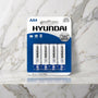 Blisterkaart met vier AA-batterijen op een marmeren plank, Super Alkaline van Hyundai