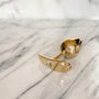 Giftbox Golden Delight goudkleurige metalen buttplug met strasssteentje op marmeren ondergrond