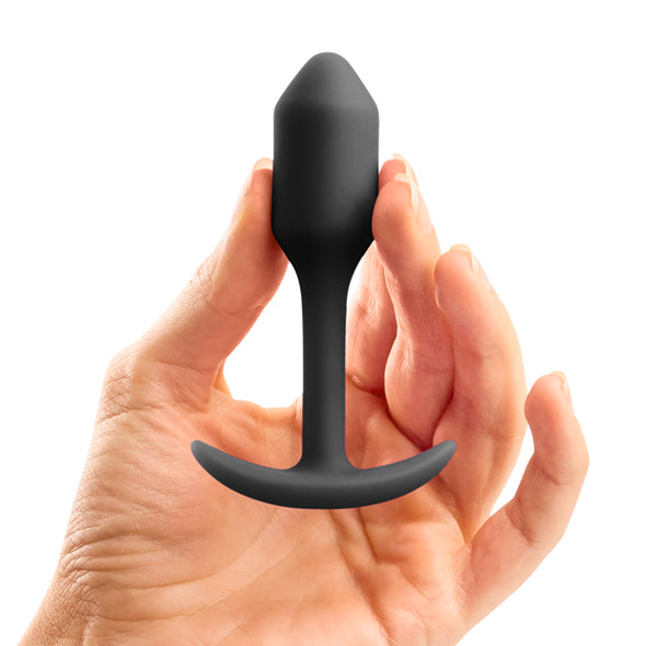 Hand met de plug, met het dunne nekje en de brede voet, Snug Plug van b-Vibe