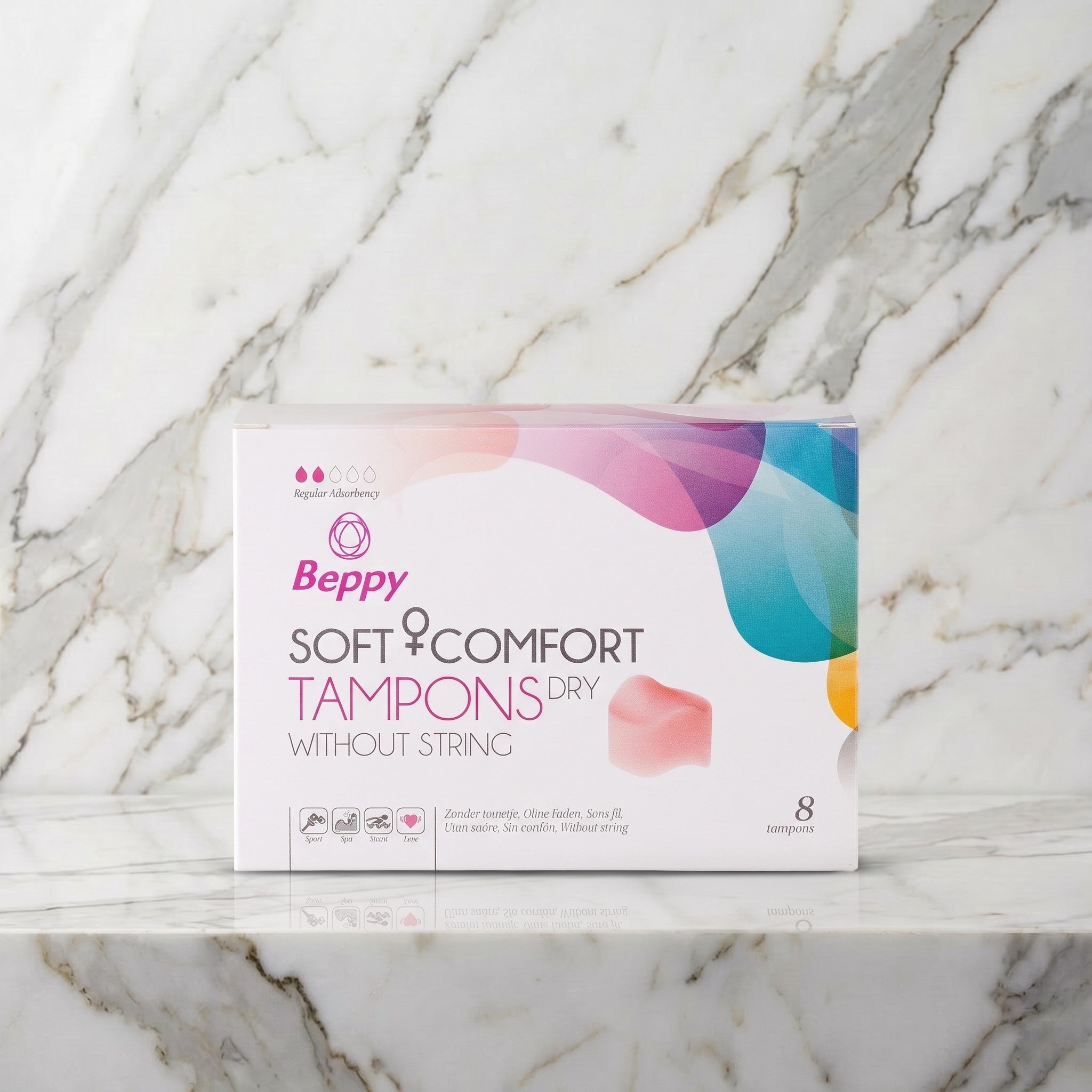 Doosje Beppy Soft Comfort Dry tampons zonder touwtje, 8 stuks, op een marmeren plank