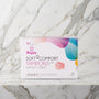 Doosje Beppy Soft Comfort Dry tampons zonder touwtje, 8 stuks, op een marmeren plank