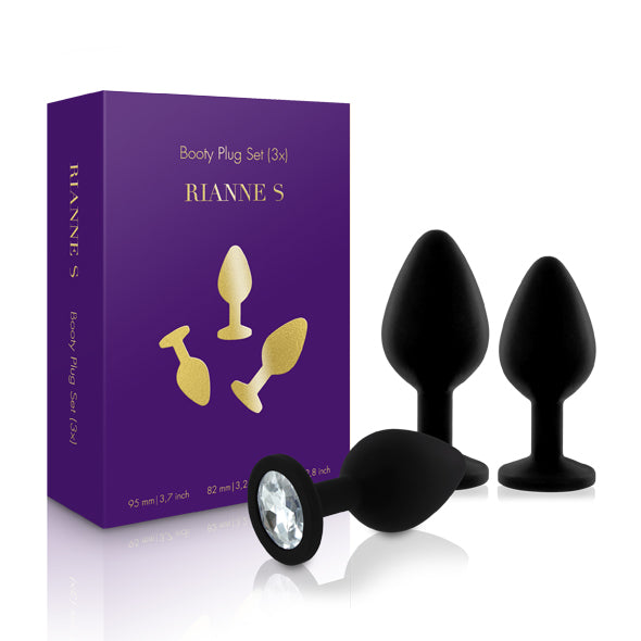 Rianne S Booty Plug Set 3-delig in zwart siliconen met kristal, naast paarse doos