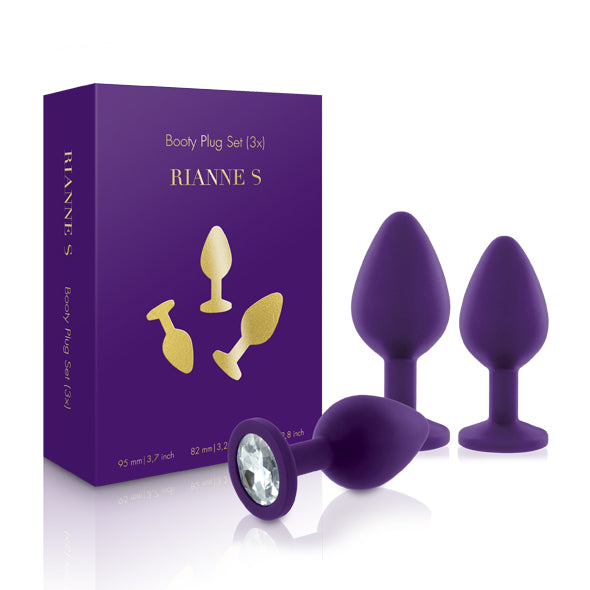 Rianne S Booty Plug Set 3-delig in paars siliconen met kristal, naast paarse doos