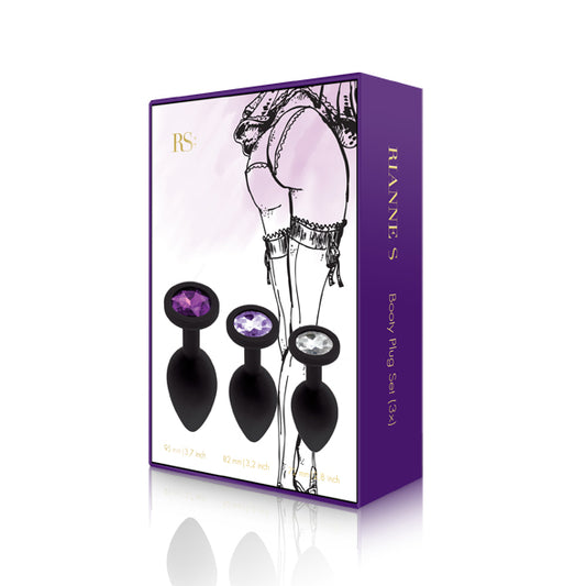 Rianne S Booty Plug Set verpakking met drie zwarte pluggen en gekleurde kristallen