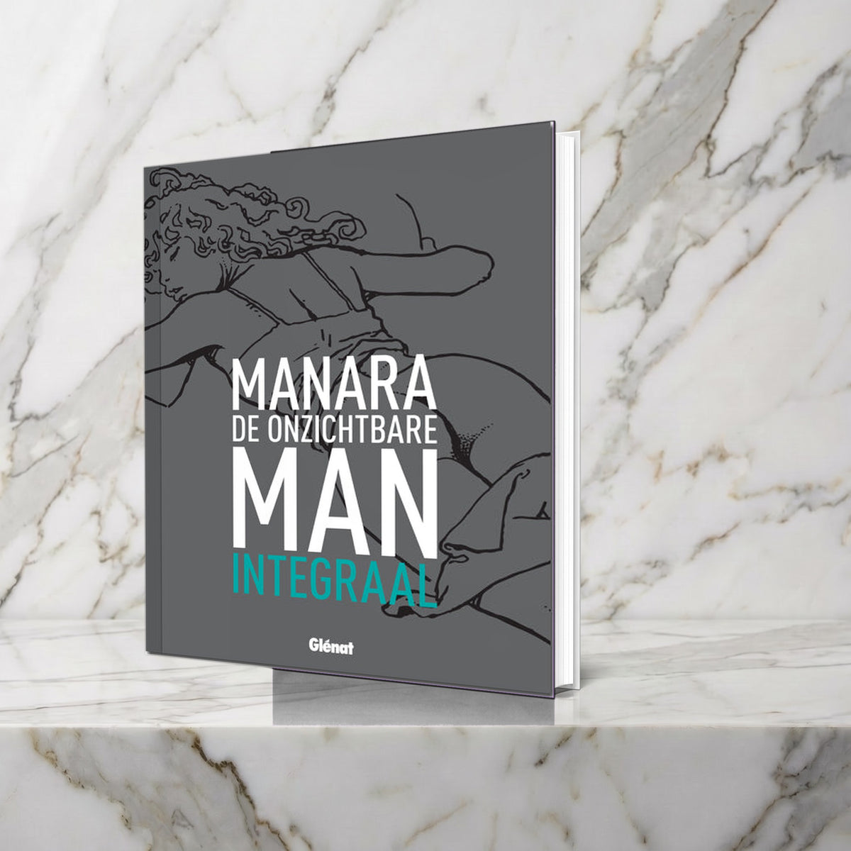Grijs hardcoveralbum De Onzichtbare Man integraal van Milo Manara op een marmeren plank
