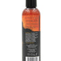 Achterkant van de fles Intimate Earth Energize massage-olie met ingredienten