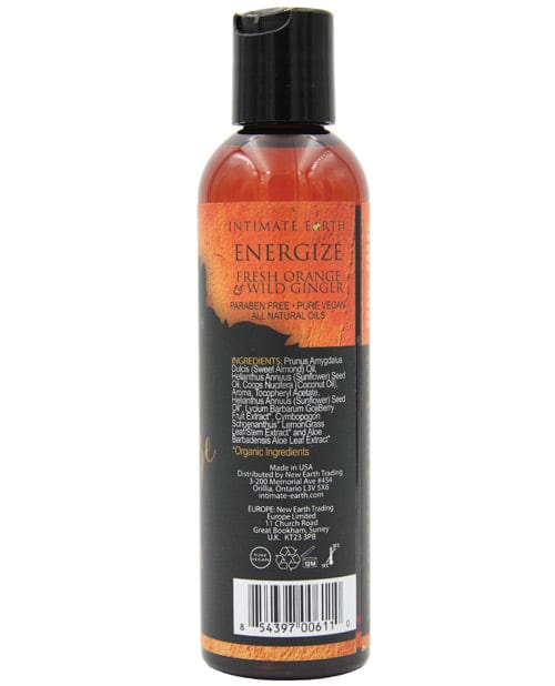 Achterkant van de fles Intimate Earth Energize massage-olie met ingredienten