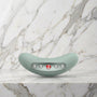 Saliegroene Fun Factory Laya III oplegvibrator liggend op een marmeren plank