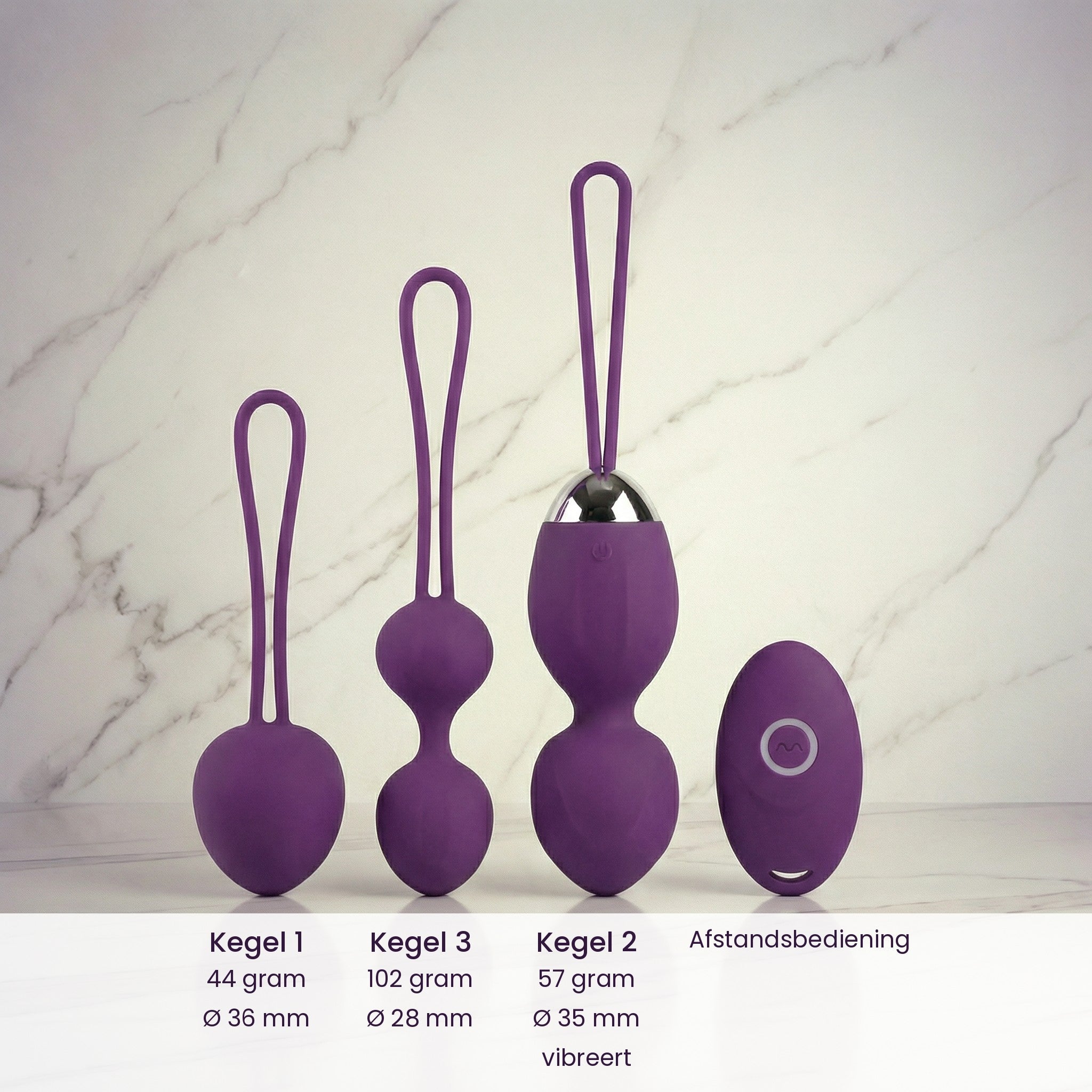 Drie kegels van de Happy Woman Kegelset Basic op marmer met gewicht en doorsnede per kegel