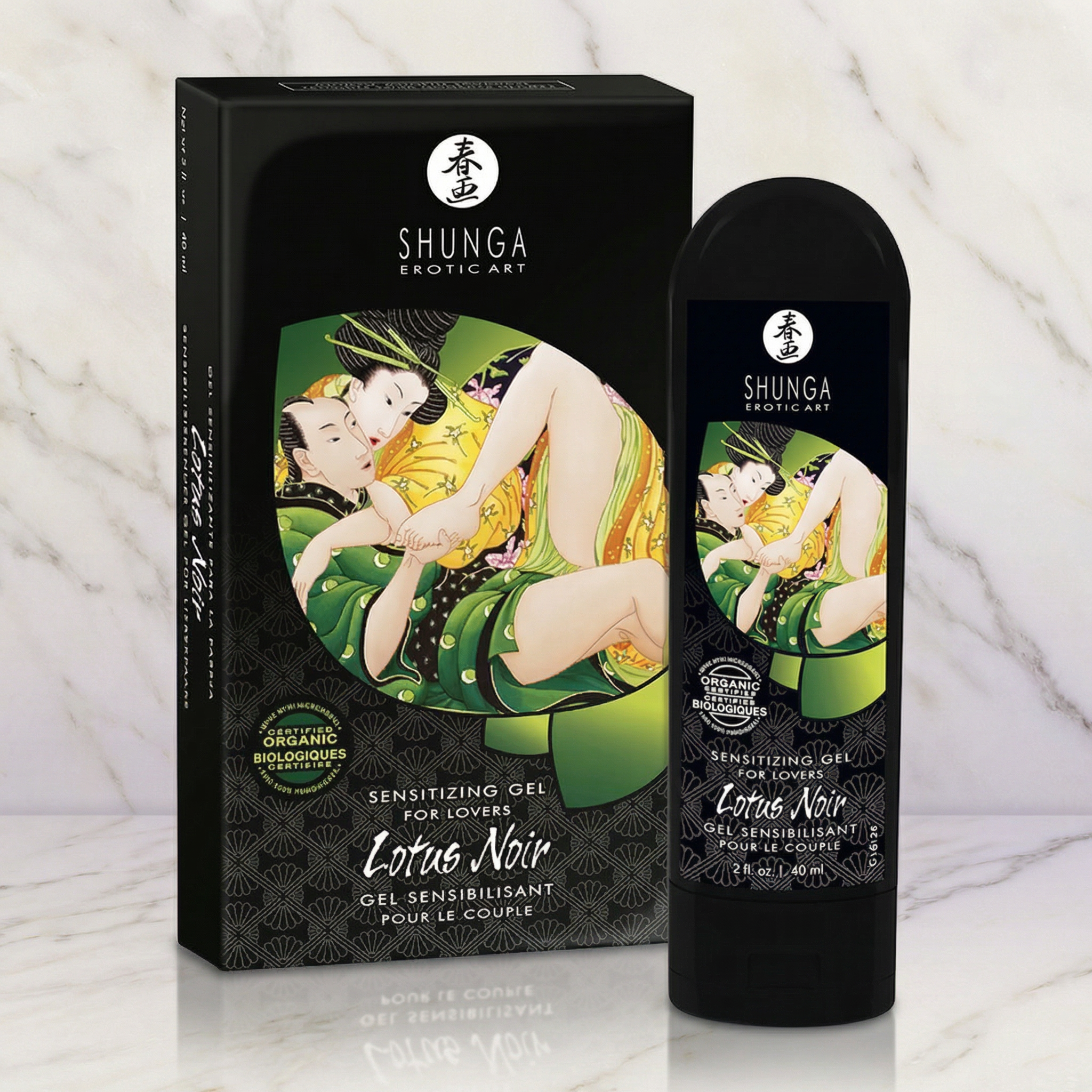 Zwarte tube van 60 ml met doos van Shunga Lotus Noir op een marmeren plank