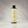 Bodygliss Pina Colada massage olie fles vooraanzicht op witte achtergrond