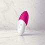 LELO Siri clitoris vibrator in roze-wit cerise, compacte handpalm-massager van siliconen