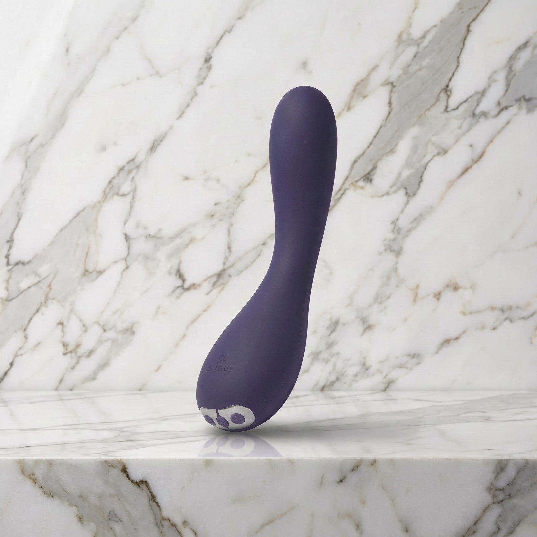 Paarse gebogen vibrator rechtop op een marmeren plank, Je Joue Uma