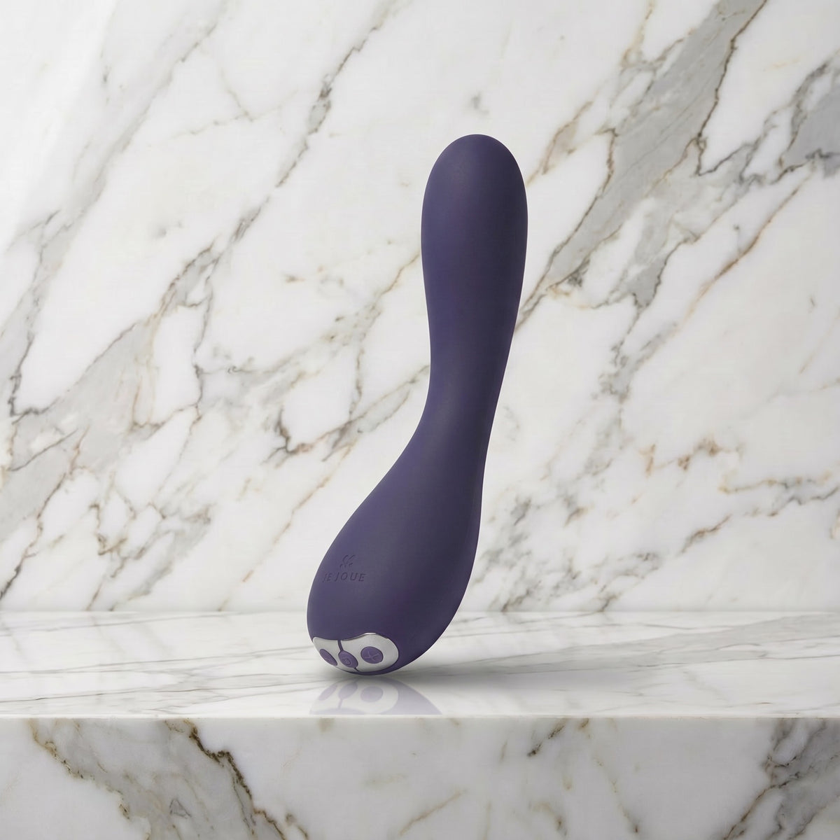 Paarse gebogen vibrator rechtop op een marmeren plank, Je Joue Uma