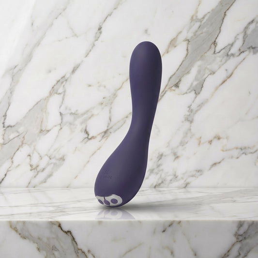 Paarse gebogen vibrator rechtop op een marmeren plank, Je Joue Uma