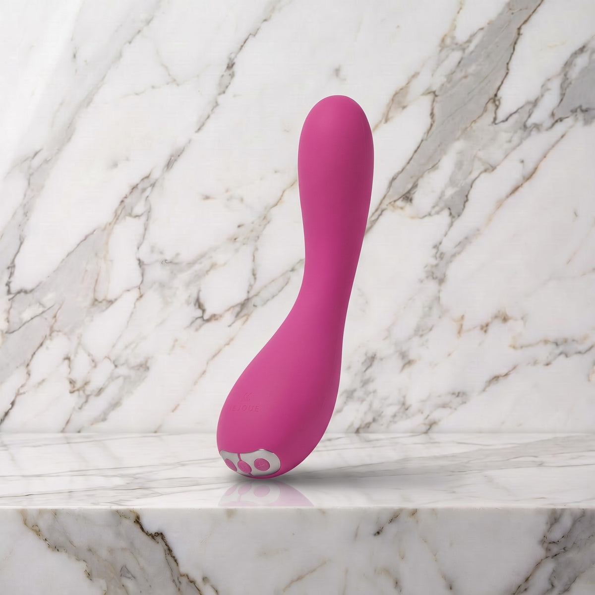 Roze gebogen vibrator rechtop op een marmeren plank, Je Joue Uma