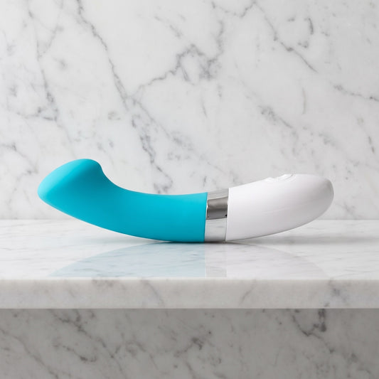 Turquoise G-spot vibrator met wit handvat op een marmeren plank, LELO Gigi 2