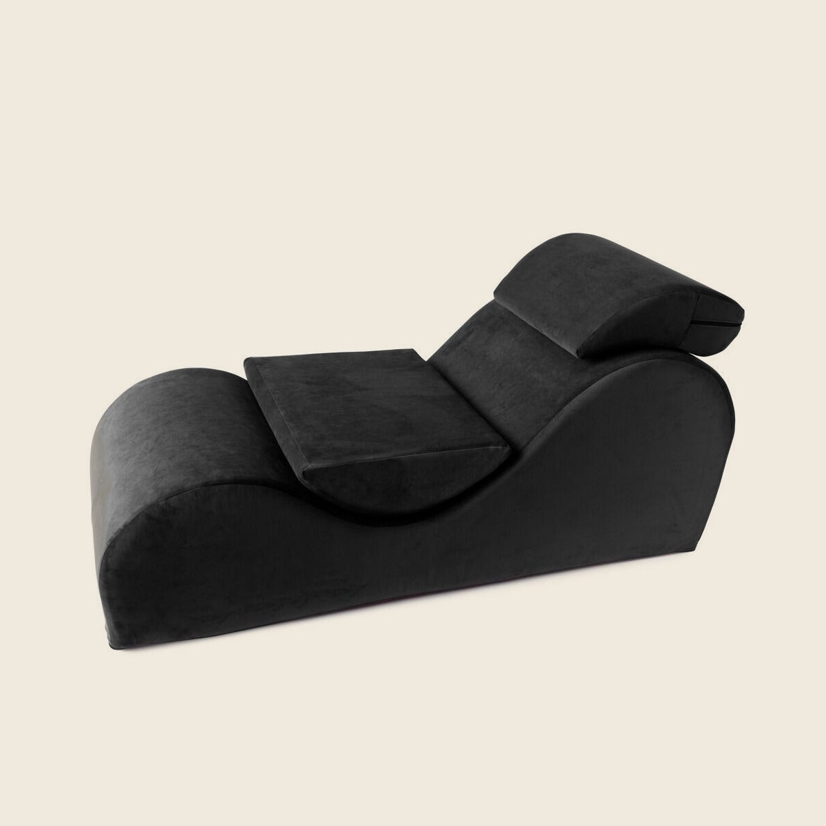 Liberator Esse Lounger in zwart met hoofdsteun en halfrond kussen, zijaanzicht