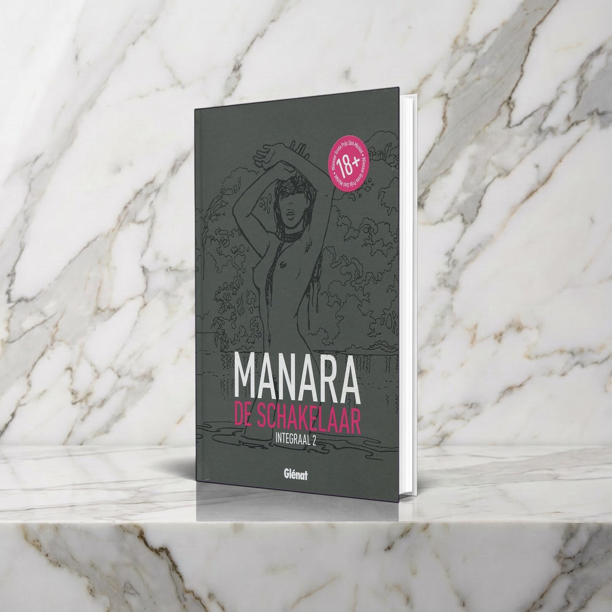 De Schakelaar Integraal 2 van Milo Manara rechtop op een marmeren plank