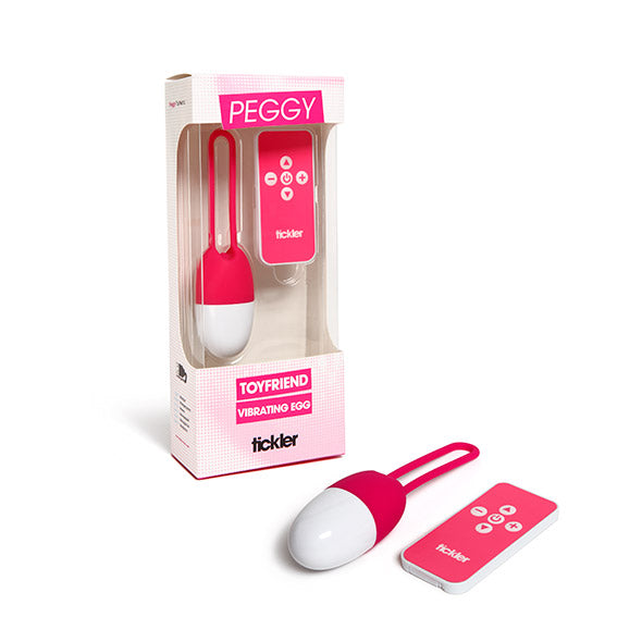Tickler Peggy Toyfriend vibrerend ei in verpakking naast uitgepakt roze-wit ei met afstandsbediening