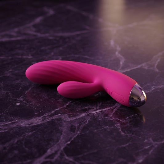 Sfeerbeeld: roze verwarmende vibrator met zilveren kap op donkerpaars marmer, Svakom Angel