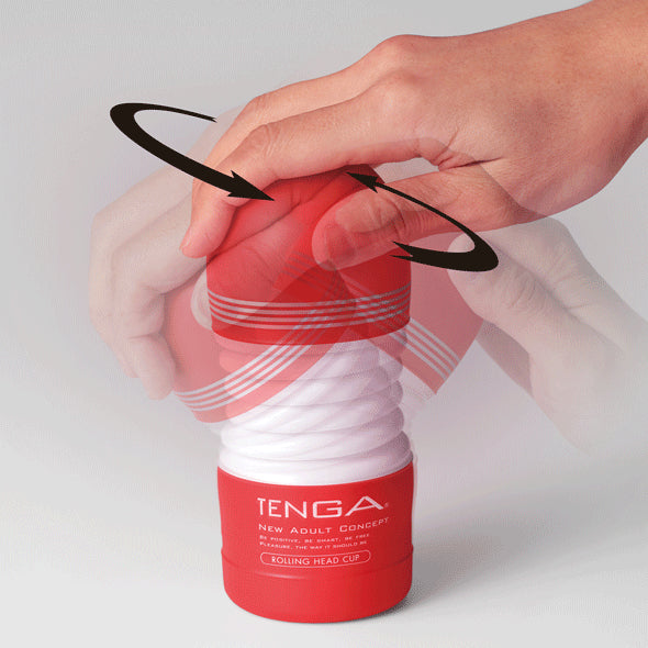 Handen draaien de rode kop van Tenga Rolling Head Cup, toont 360° rollende werking