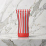 Rood met zilver gestreepte beker op een marmeren plank, Tenga Soft Tube Cup
