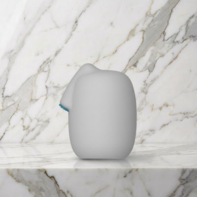 Grijs Vibeggs masturbatie-eitje met turquoise vibrerend staafje op een marmeren plank