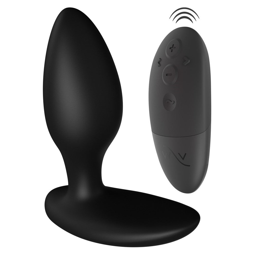 Zwarte Ditto+ buttplug naast de zwarte afstandsbediening met vier knoppen, We-Vibe