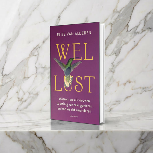 Boek Wellust met paarse omslag en kolibrie rechtop op een marmeren plank, Elise van Alderen